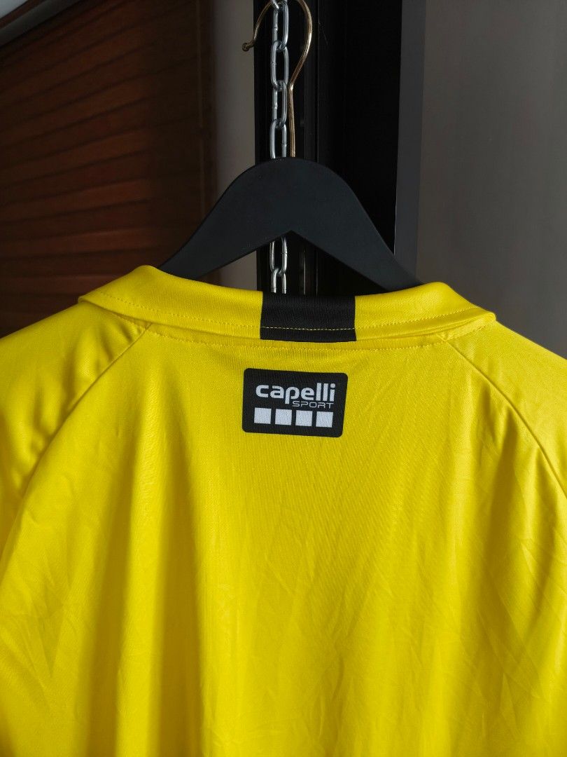 Capelli Sport Us Soccer Referee Jersey 2024 (Category: Tshirts & Polo Shirts ) located in Siniloan. Submitted by wingedwardrobe (Listing ID 1453558694, Image 3). Description: A bright yellow Capelli Sport U.S. Soccer Federation 2024 referee jersey with polo collar, two front chest pockets with Capelli and USA referee badges, black stripe details down the front, and Capelli Sport logo on the sleeve. 📢 𝐒𝐇𝐎𝐏 𝐑𝐄𝐌𝐈𝐍𝐃𝐄𝐑𝐒 📢 - 𝐒𝐢𝐳𝐞𝐬 �