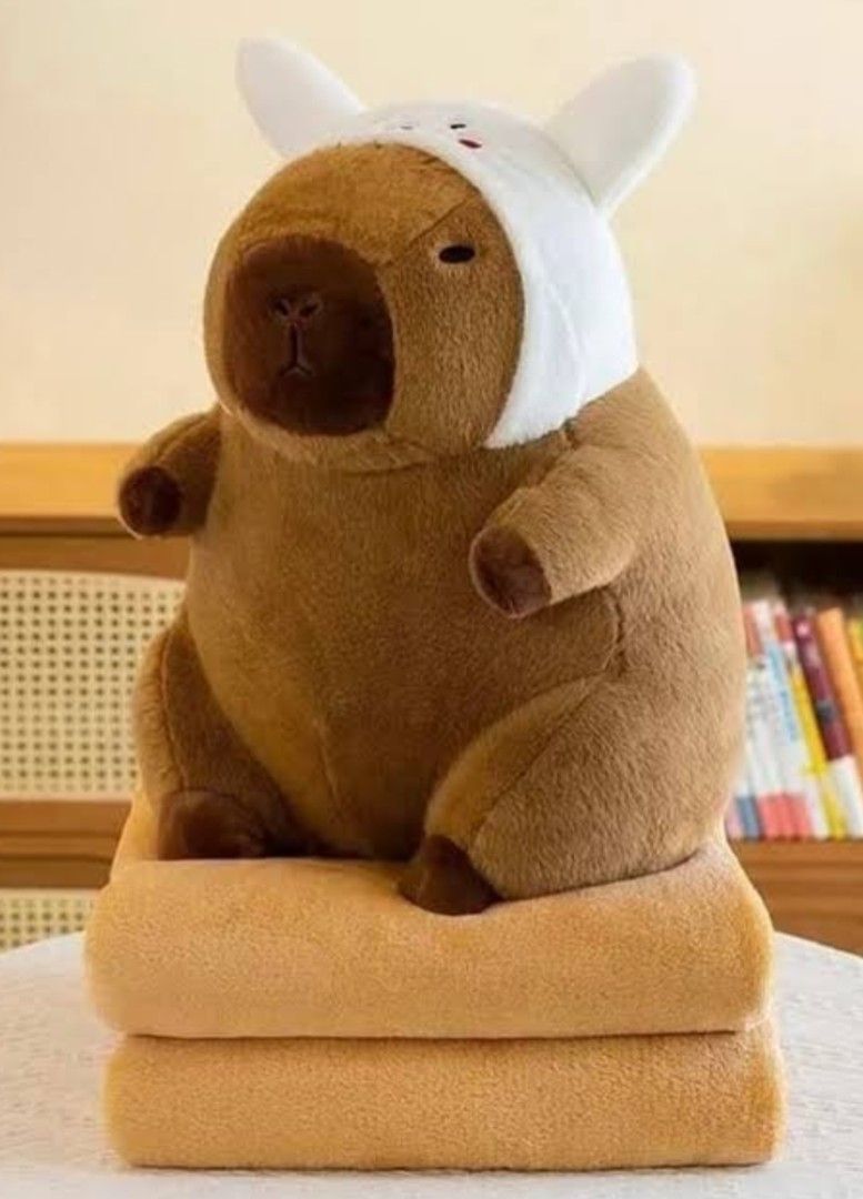 Capybara plush toy with white bunny hat (Category: Plushies & Soft Toys) located in Manila. Submitted by liziee.collections (Listing ID 1465148623, Image 2). Description: Perfect for gift - Buyer may request a gift bag and customized letter for gifting ❀ With freebies ❀ PRICE IS STILL NEGOTIABLE ❀ What you see is what you get.