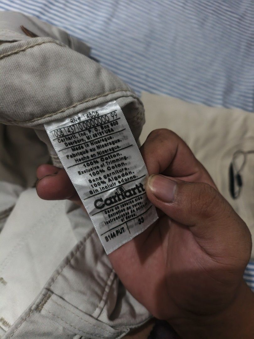 Carhartt B144 PUT Canvas Work Utility Shorts Size 33 (Category: Shorts) located in Caloocan City. Submitted by bry_anjay (Listing ID 1465030679, Image 3). Description: - Brand: Carhartt - Style: B144 PUT Canvas Utility Shorts - Color: Light Beige - Size: Tagged 33 waist - Material: Rugged cotton duck fabric - Features: Classic carpenter pocket setup, leather logo patch on back pocket, branded metal button, heavy-duty belt loops - Condition: Clean