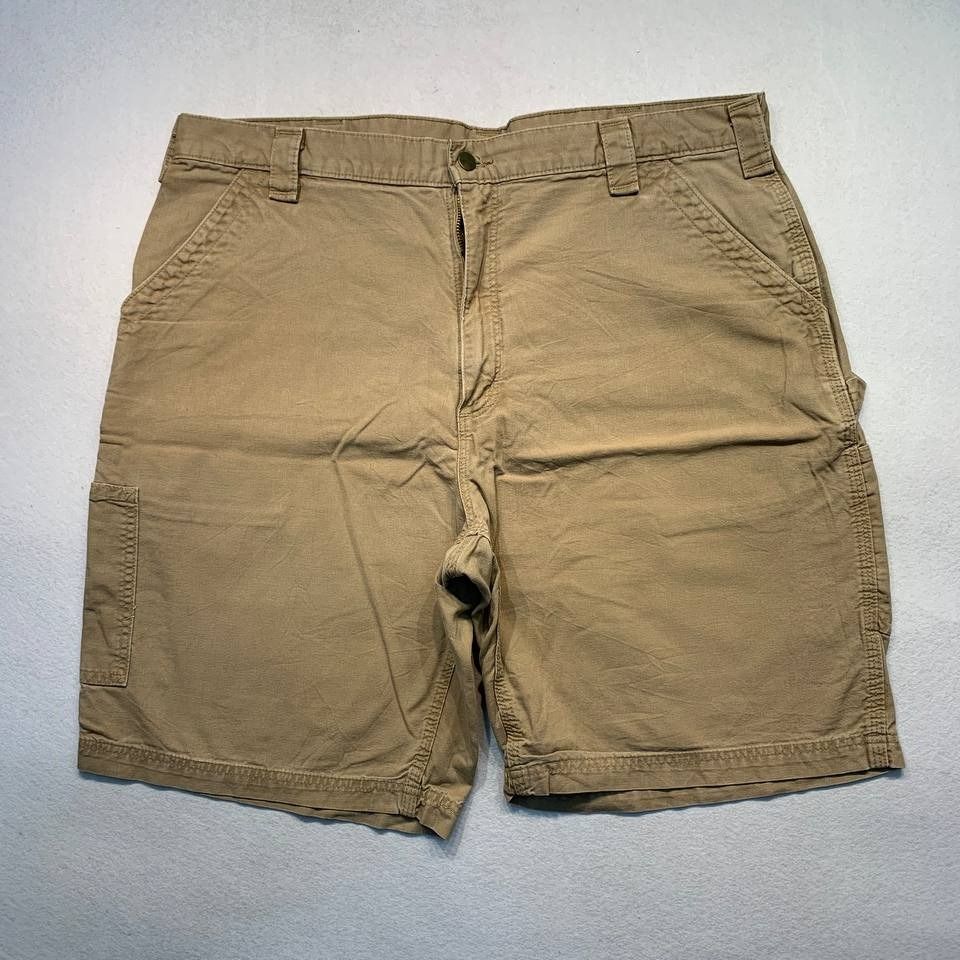 Carhartt B147 DKH Brown Shorts (Category: Shorts) located in Mandaluyong City. Submitted by theroom501 (Listing ID 1465108475, Image 2). Description: Carhartt B147 DKH Brown Shorts Style Code: B147 DKH Size on Tag: 40 Color: Brown Condition: Good pre-owned condition with visible signs of previous use. Flaws/Issues: rust stain Flat Lay Measurements: Pit to Pit: 40 inches Length: 22 inches Leegopening Length: 12 inches Price: 2500.