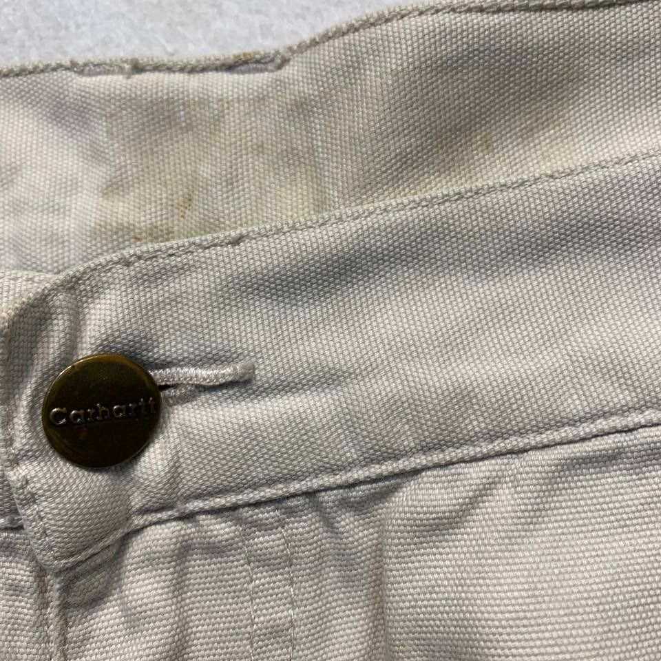 Carhartt B164 PUT Cargo Short (Category: Shorts) located in Mandaluyong City. Submitted by theroom501 (Listing ID 1465121117, Image 3). Description: Carhartt B164 PUT Cargo Short Style Code: B164 PUT Size on Tag: 38 Color: TAN Condition: Good pre-owned condition with visible signs of previous use. Flaws/Issues:rust stain distressed visible yellow stain, and peeling leather patch. Flat Lay Measurements: Pit to Pit: 38 inches Length: 23 inches Leeg
