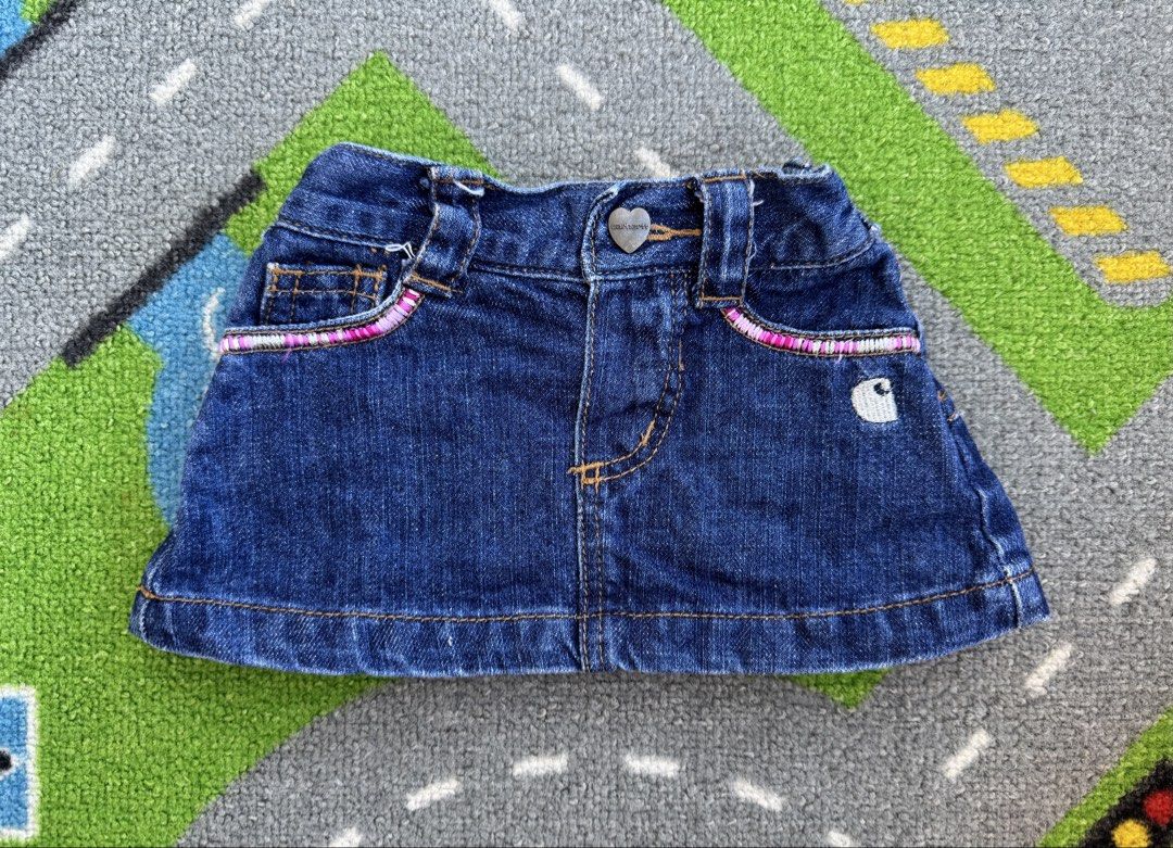 Carhartt Denim Skirt (Category: Babies & Kids Fashion) located in Rizal. Submitted by preloovved (Listing ID 1465083354, Image 1). Description: Super cute Carhartt blue denim skirt. Features heart buttons, pink embroidery, logo patches, an elastic back waist, and a ruffled hem. Durable and stylish for everyday wear. Carhartt denim skirt for kids. Classic design with button closure, pockets, and pleated back. Features a small Carhartt logo and pin
