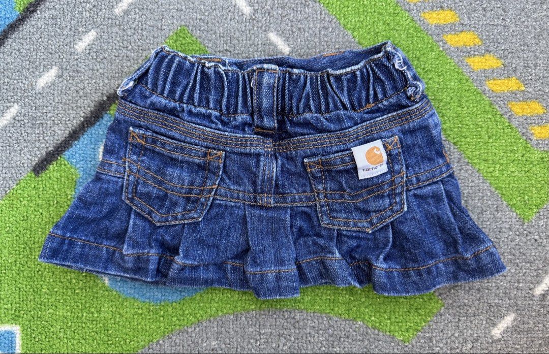 Carhartt Denim Skirt (Category: Babies & Kids Fashion) located in Rizal. Submitted by preloovved (Listing ID 1465083354, Image 2). Description: Super cute Carhartt blue denim skirt. Features heart buttons, pink embroidery, logo patches, an elastic back waist, and a ruffled hem. Durable and stylish for everyday wear. Carhartt denim skirt for kids. Classic design with button closure, pockets, and pleated back. Features a small Carhartt logo and pin