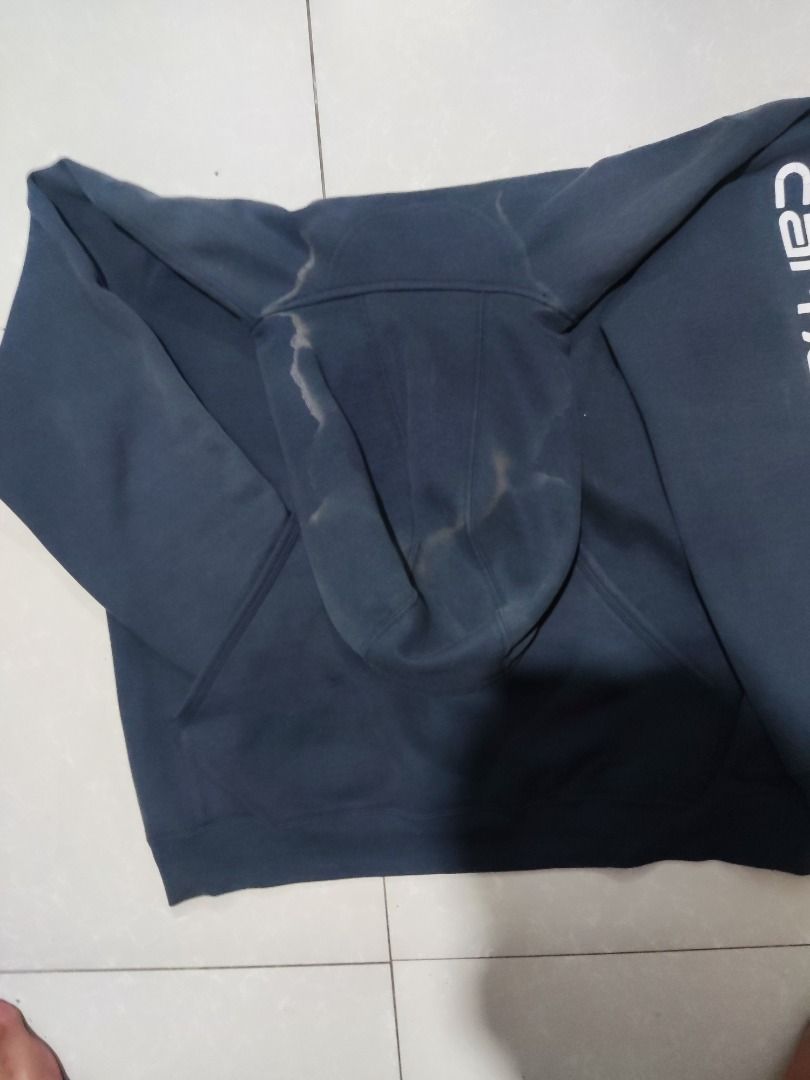 Carhartt script navy blue hoodie (Category: Coats, Jackets and Outerwear) located in Rizal. Submitted by skilidilidu (Listing ID 1465082622, Image 2). Description: - Brand: Carhartt - Style: Long sleeve hooded sweatshirt with front pouch pocket and adjustable drawstring hood - Condition: Pre-loved with natural fading and discoloration along the hood dimensions 25x29 issue see in pictures .