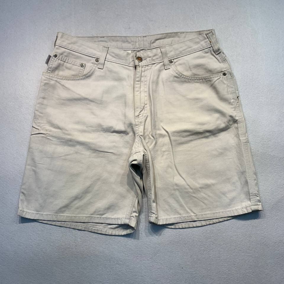 Carhartt WB190 PUT Shorts (Category: Shorts) located in Mandaluyong City. Submitted by theroom501 (Listing ID 1465117883, Image 2). Description: Carhartt WB190 PUT Shorts Style Code: WB190 PUT Size on Tag: 12 Color: TAN Condition: Good pre-owned condition with visible signs of previous use. Flaws/Issues:rust stain distressed visible yellow stain, and peeling leather patch. Flat Lay Measurements: Pit to Pit: 33 inches Length: 19 inches Leegopening
