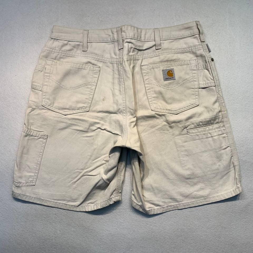 Carhartt WB190 PUT Shorts (Category: Shorts) located in Mandaluyong City. Submitted by theroom501 (Listing ID 1465117883, Image 1). Description: Carhartt WB190 PUT Shorts Style Code: WB190 PUT Size on Tag: 12 Color: TAN Condition: Good pre-owned condition with visible signs of previous use. Flaws/Issues:rust stain distressed visible yellow stain, and peeling leather patch. Flat Lay Measurements: Pit to Pit: 33 inches Length: 19 inches Leegopening