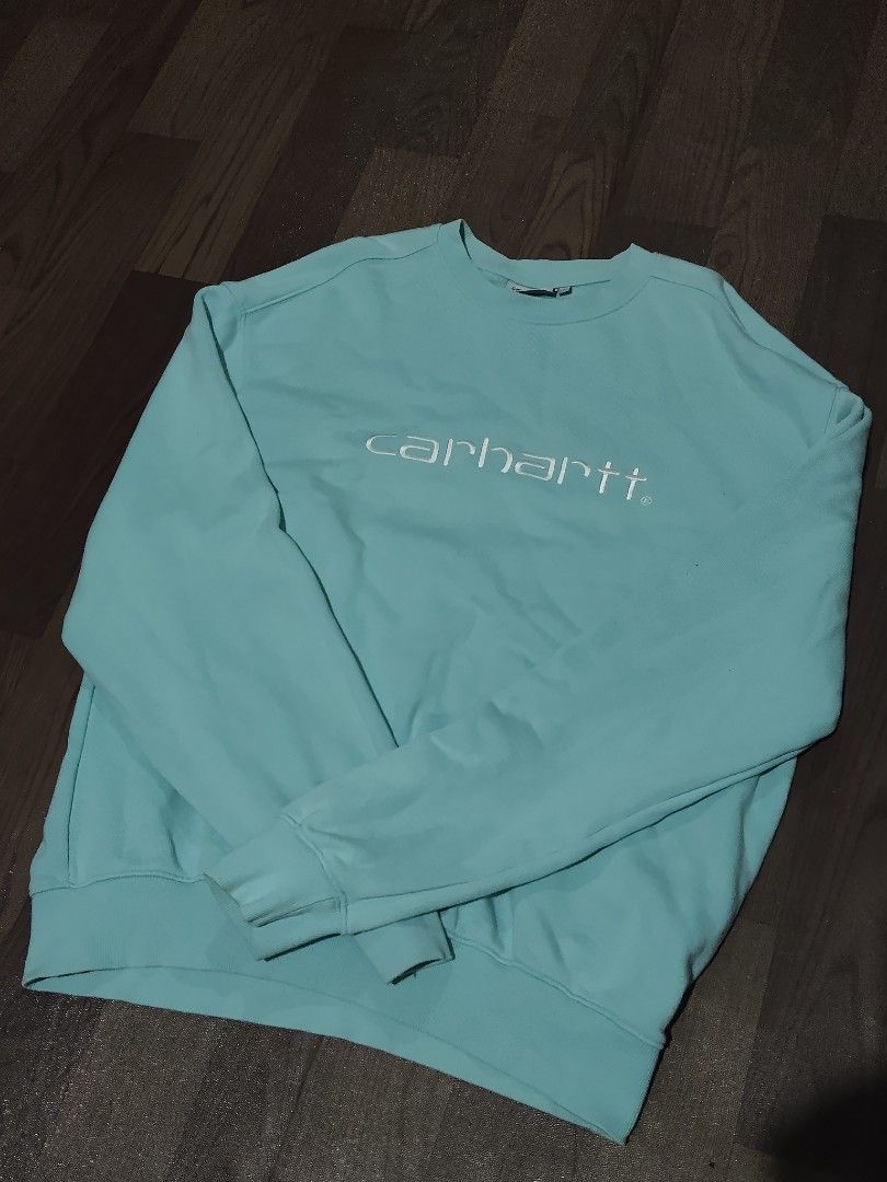 Carhartt WIP Tristan Sweatshirt Light Blue Size L (Category: Coats, Jackets and Outerwear) located in Mamburao. Submitted by renzocutie (Listing ID 1464975310, Image 1). Description: LENGTH 29 WIDTH 24 EXCELLENT CONDITION NO ISSUE - Brand/Model: Carhartt WIP Tristan Sweatshirt - Color: Light Blue - Size: L (Tag attached) - Details: Embroidered white Carhartt script logo on chest, crewneck style, ribbed cuffs and hem - Material: 80% cotton, 20% po