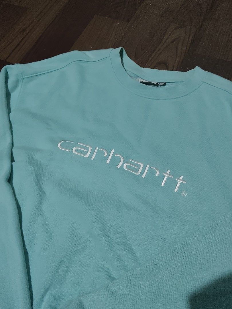 Carhartt WIP Tristan Sweatshirt Light Blue Size L (Category: Coats, Jackets and Outerwear) located in Mamburao. Submitted by renzocutie (Listing ID 1464975310, Image 2). Description: LENGTH 29 WIDTH 24 EXCELLENT CONDITION NO ISSUE - Brand/Model: Carhartt WIP Tristan Sweatshirt - Color: Light Blue - Size: L (Tag attached) - Details: Embroidered white Carhartt script logo on chest, crewneck style, ribbed cuffs and hem - Material: 80% cotton, 20% po