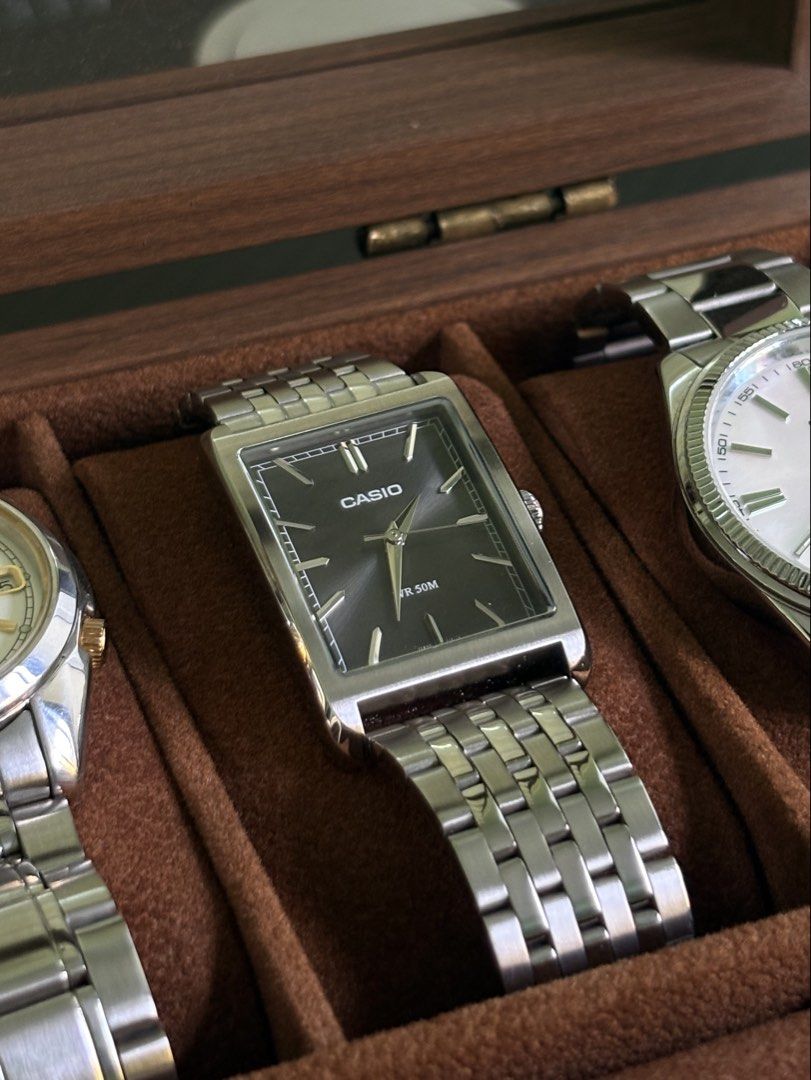 Casio Rectangular Watch - Ref# MTPB251D (Category: Men's Watches) located in Quezon City. Submitted by renceeeyy06 (Listing ID 1463069989, Image 1). Description: - Classic Casio watch - Rectangular face - Silver metal strap - Dark grey dial with gold-tone hands and markers - Simple and sleek design - Water resistant 50m - Includes original box - Complete links - 1 year warranty 'til September 2027 ✅ Money-back guarantee if proven fake 📍 Mandaluy