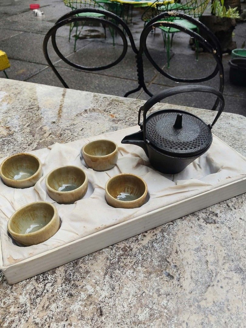 Cast iron teapot set with cups (Category: Coffee & Tea Tableware) located in Caloocan City. Submitted by kaymatias (Listing ID 1464994326, Image 3). Description: - Authentic Japanese-style heavy-duty cast iron teapot set - Includes matching earthy-glazed cups and a built-in gold-tone strainer basket - Beautiful textured exterior on the teapot - Comes complete in a luxury fabric-lined presentation box - Perfect for tea lovers or as a thoughtful gi