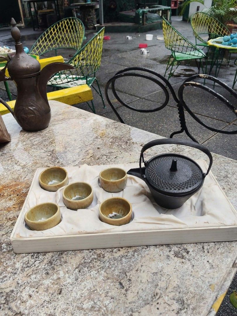 Cast iron teapot set with cups (Category: Coffee & Tea Tableware) located in Caloocan City. Submitted by kaymatias (Listing ID 1464994326, Image 2). Description: - Authentic Japanese-style heavy-duty cast iron teapot set - Includes matching earthy-glazed cups and a built-in gold-tone strainer basket - Beautiful textured exterior on the teapot - Comes complete in a luxury fabric-lined presentation box - Perfect for tea lovers or as a thoughtful gi