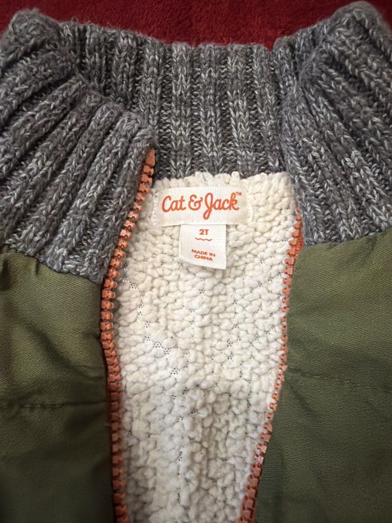 Cat & Jack Toddler Quilted Sweater Jacket Size 2T (Category: Babies & Kids Fashion) located in Manila. Submitted by karlaaricheta (Listing ID 1465081874, Image 3). Description: - Brand/Model: Cat & Jack kids zip-up jacket - Size: 2T - Design: Olive green quilted body with grey knit sleeves and collar, accented with an orange front zipper - Interior: Lined with ultra-soft white sherpa for maximum warmth - Condition/Use: Great layering piece for co