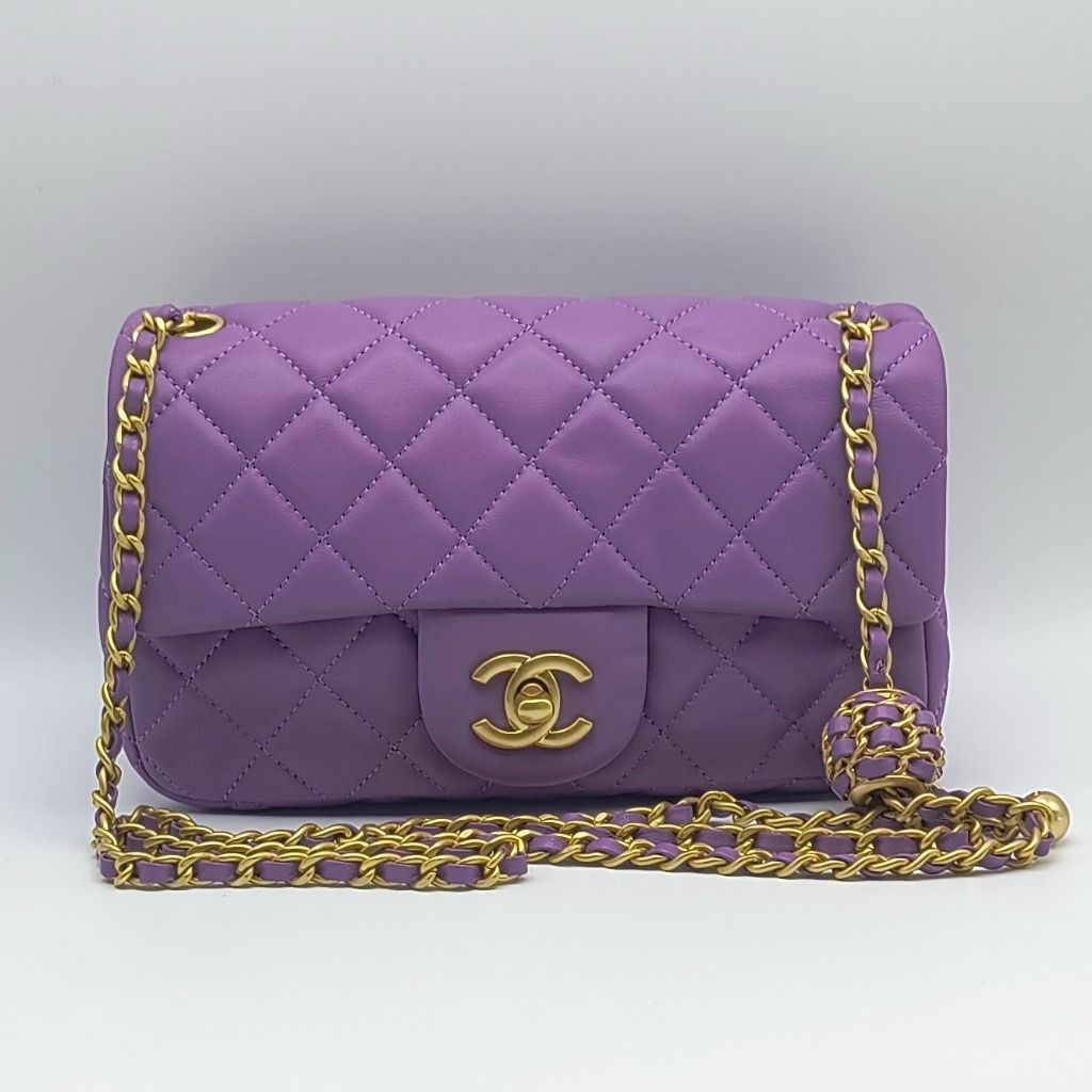 Chanel Mini Rectangular Pearl Crush Flap Bag - Purple (Category: Luxury Bags & Wallets) located in Cebu City. Submitted by affordabagss (Listing ID 1465145891, Image 1). Description: Chanel Mini Rectangular Pearl Crush Flap Bag in purple lambskin leather. Features the signature adjustable Pearl Crush chain, matte gold hardware, and classic CC turn-lock closure. Can be worn over the shoulder or crossbody. Length: 20 cm Height: 12 cm Depth: 6 cm Co