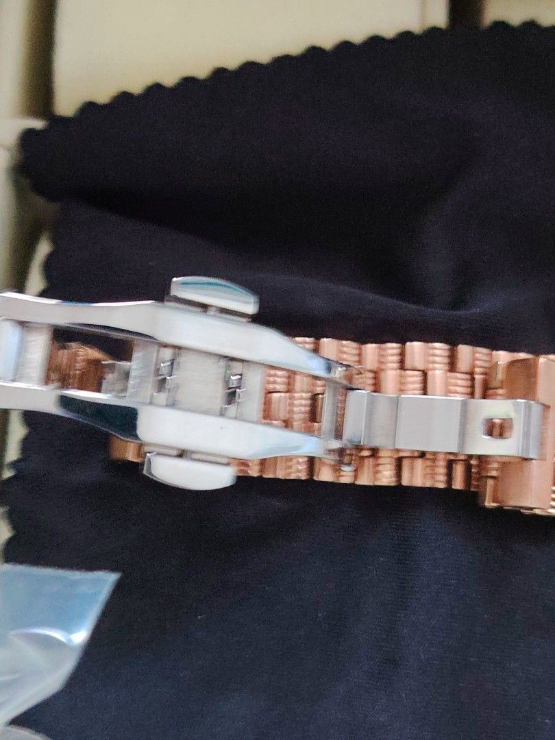 Chanel Rose Gold Diamond Bezel Watch (Category: Women's Watches) located in Paranaque City. Submitted by lucille1280 (Listing ID 1464994810, Image 3). Description: - Authentic Chanel rose gold watch - Round silver sunburst dial with crystal-accented floral motif - Bezel entirely set with sparkling small -replica crystals - Matching rose gold link bracelet with secure deployment clasp - Crown features a chic dark cabochon stone inset - Case back e