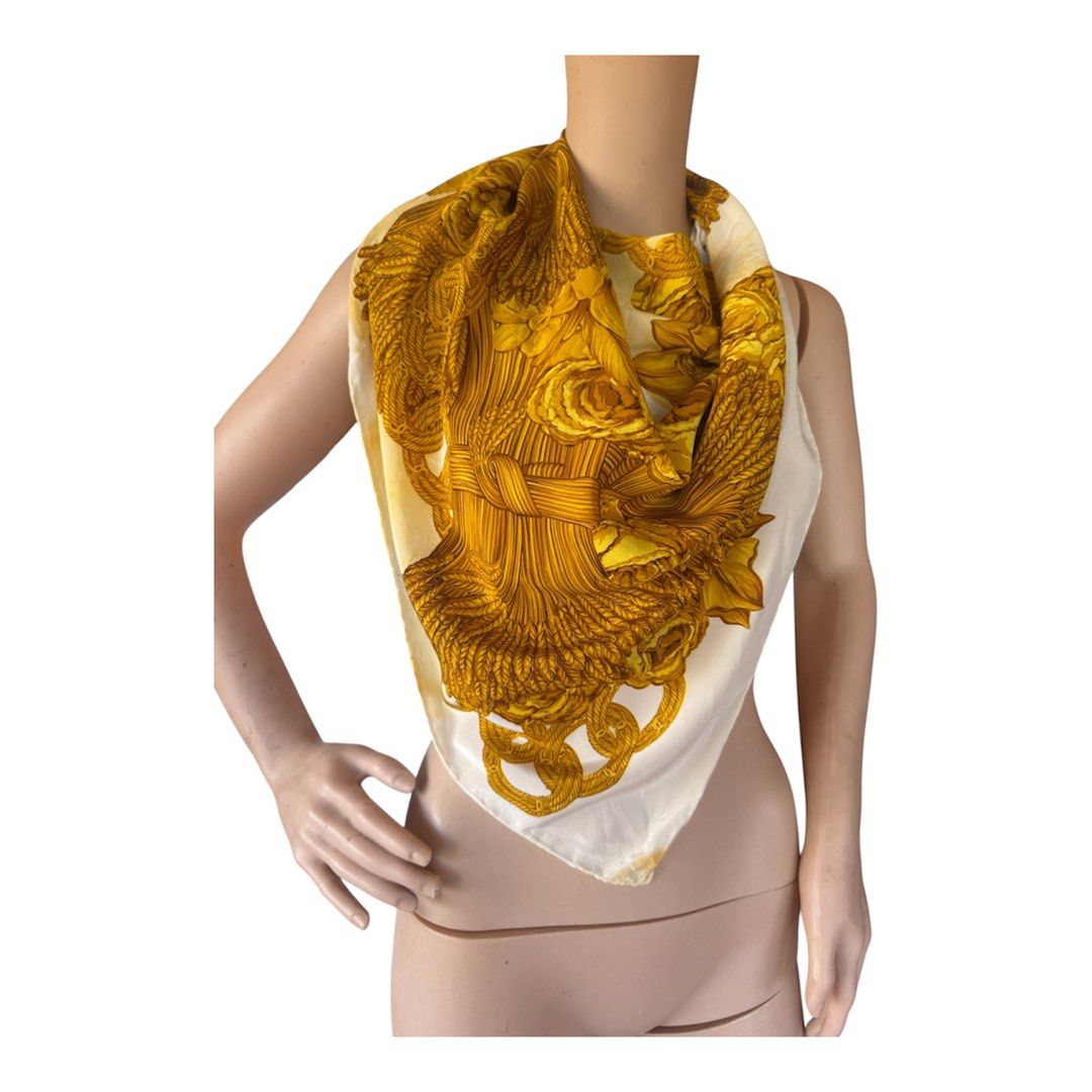 Chanel Silk Scarf Gold (Category: Scarves) located in Lingayen. Submitted by lux_thrift (Listing ID 1464982478, Image 2). Description: location pangasinan rare piece vintage needs dry cleaning not sure about the color transfer has minor pinholes approximately 39x40 inches.