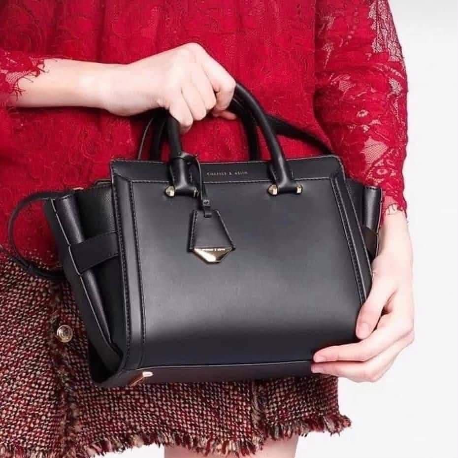 Charles & Keith Structured Trapeze Bag (Category: Cross-body Bags) located in Manila. Submitted by chic.collectivemnl (Listing ID 1464989298, Image 1). Description: .