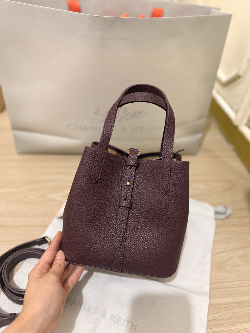 Charles and Keith Burgundy Bag (Category: Cross-body Bags) located in Quezon City. Submitted by shopmyprelovedph (Listing ID 1465067889, Image 3). Description: Can pass as brandnew With dust bag Still available in stores and online.