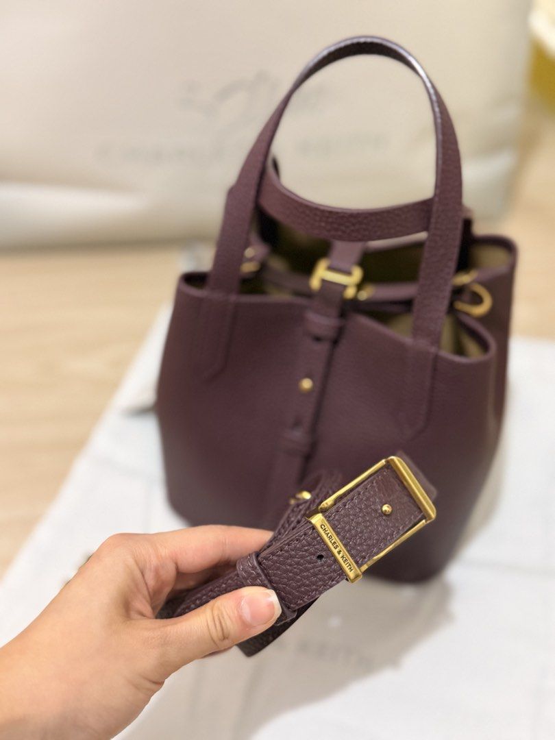 Charles and Keith Burgundy Bag (Category: Cross-body Bags) located in Quezon City. Submitted by shopmyprelovedph (Listing ID 1465067889, Image 2). Description: Can pass as brandnew With dust bag Still available in stores and online.