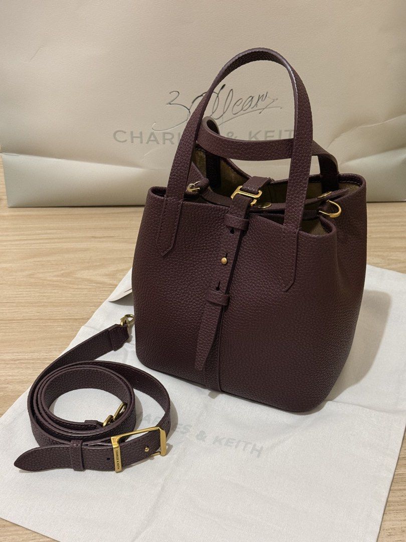 Charles and Keith Burgundy Bag (Category: Cross-body Bags) located in Quezon City. Submitted by shopmyprelovedph (Listing ID 1465067889, Image 1). Description: Can pass as brandnew With dust bag Still available in stores and online.