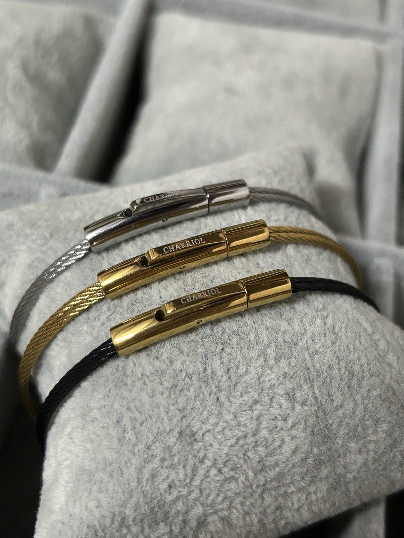 Charriol Cable Wire Stainless Steel Bracelet (Category: Jewelry) located in Manila. Submitted by elonlineshop (Listing ID 1465169165, Image 3). Description: Charriol wire cable bracelets. Includes one silver with silver clasp, one gold with gold clasp, and one black cable with gold clasp. Distinct engraved Charriol branding on the metal clasp bars. Secure clip lock closure mechanism. Stack them together or wear separately. Minimalist everyday jew