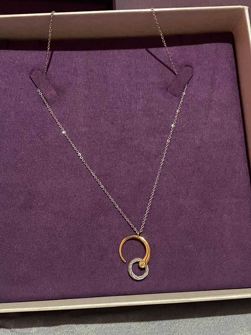 Charriol Infinity Zen Necklace (Category: Necklaces) located in Manila. Submitted by goodbuying_items0211 (Listing ID 1465170242, Image 1). Description: - Brand: Charriol Authentic - Style: Infinity Zen necklace (gold and silver tones) - Design: Interlocking cable pendant with engraved branding - Condition: Brand new, never worn, carefully stored in box - Inclusions: Original chain, guarantee card (dated 5/31/26), and purple presentation box - Pe
