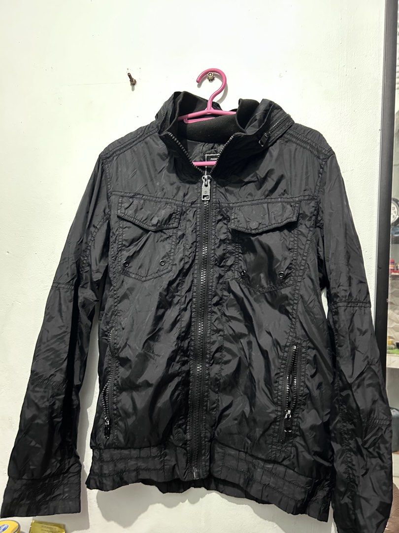 Chasecult Black Utility Jacket Windbreaker with Pockets (Category: Coats, Jackets and Outerwear) located in Manila. Submitted by elnemeeh_05 (Listing ID 1465019564, Image 2). Description: - Brand/Model: Chasecult Black Jacket - Material: Dark textured nylon, lightweight for daily wear - Closure: Full zip front with ribbed collar - Pockets: Multiple functional front pockets with secure button flaps and zipper details - Color: Solid black colorway.