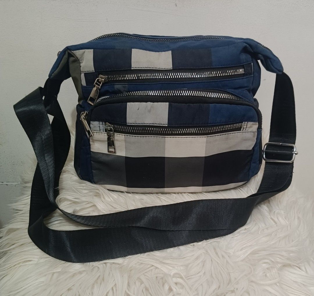 Checkered Multi Pocket Sling Bag (Category: Cross-body Bags) located in Davao. Submitted by naxarugal (Listing ID 1464969991, Image 1). Description: ukay source no issue need lng ng laba size height 7.7 inches length 10 inches width 4.7 inches.