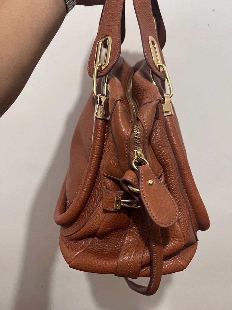 Chloe (Category: Luxury Bags & Wallets) located in Cabanatuan. Submitted by danielantonio (Listing ID 1465079397, Image 3). Description: brown leather grained texture two top handles adjustable shoulder strap top zip fastening gold-tone hardware Condition: EXCELLENT. This previously owned item is in near-perfect condition with no signs of damage or use..