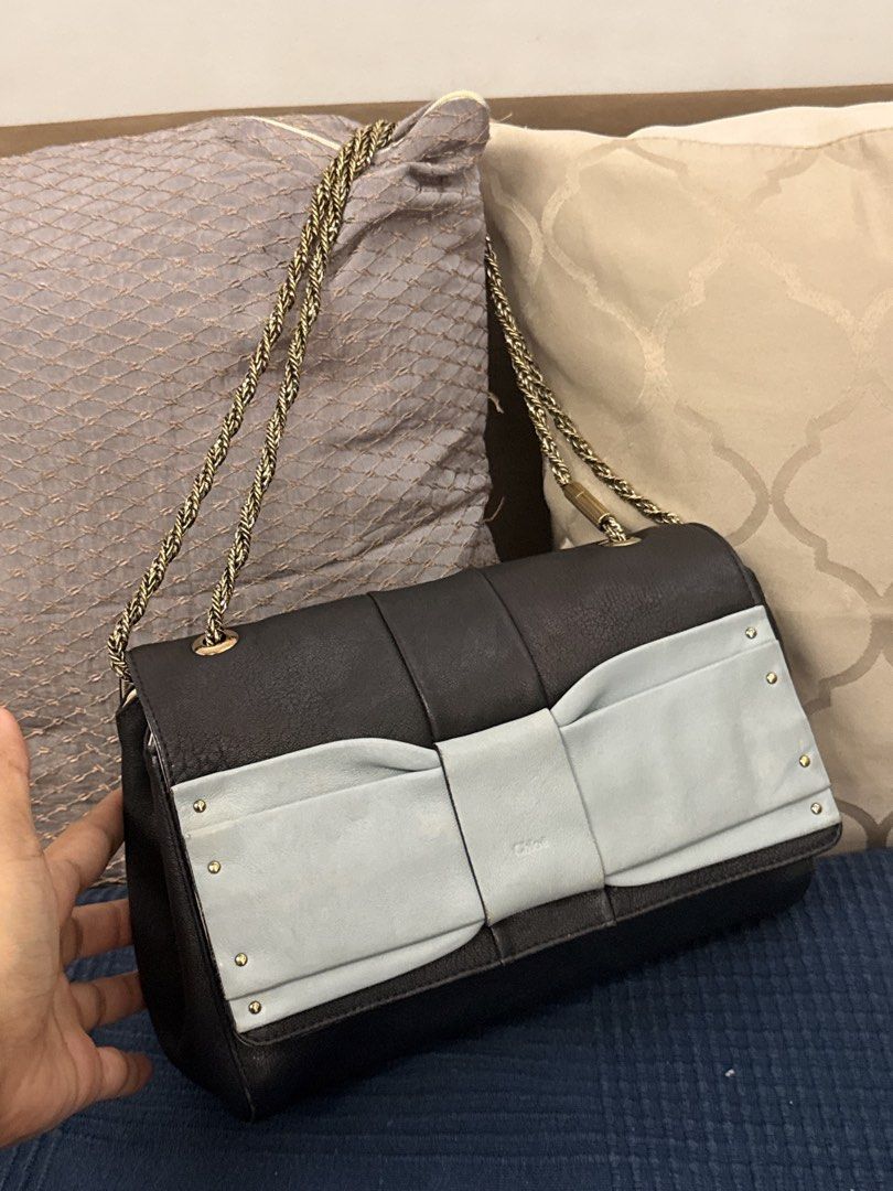 Chloe June Bow Chain Bag preloved (Category: Luxury Bags & Wallets) located in San Pablo. Submitted by iamtrina (Listing ID 1464993576, Image 3). Description: Under flap with stain Tolerable discolaration on the light blue bow Guaranteed authentic Pls see code and holo sticker Can be worn as shoulder or crossbody.