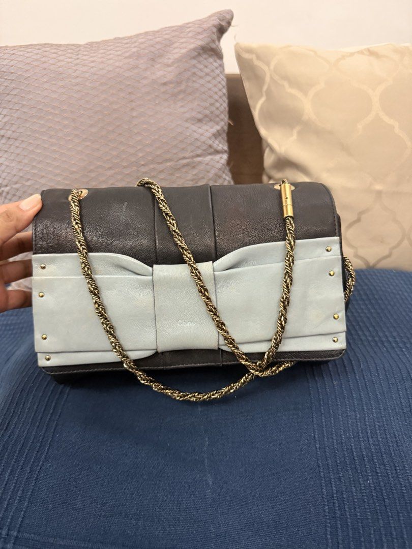 Chloe June Bow Chain Bag preloved (Category: Luxury Bags & Wallets) located in San Pablo. Submitted by iamtrina (Listing ID 1464993576, Image 2). Description: Under flap with stain Tolerable discolaration on the light blue bow Guaranteed authentic Pls see code and holo sticker Can be worn as shoulder or crossbody.