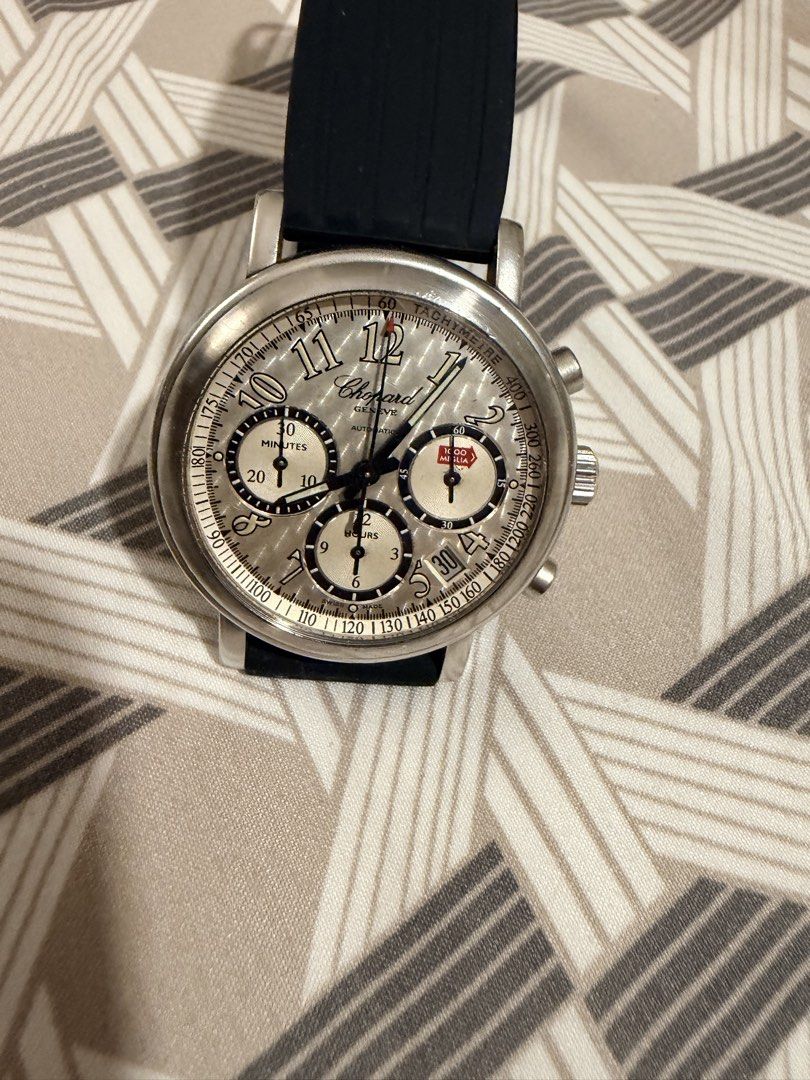 Chopard Jacky Ickx Edition Automatic Watch (Category: Men's Watches) located in Manila. Submitted by jack81472 (Listing ID 1465080882, Image 1). Description: - Brand: Chopard Automatic Chronograph - Dial: Silver with black sub-dials, Arabic numerals, and outer tachymeter scale - Case: Stainless steel round case with exhibition back - Limited Edition: Engraved 'Edition Jacky Ickx' and numbered 903 out of 1000 - Strap: Comfortable black rubber stra