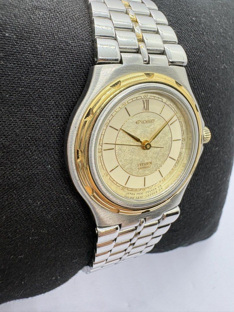 Citizen Exceed Quartz Watch (Category: Women's Watches) located in Quezon City. Submitted by rentoti (Listing ID 1464995855, Image 3). Description: - Brand/Model: Citizen Exceed Classic Dress Watch - Movement: Reliable Japan Quartz (Battery-powered) - Dial: Textured champagne dial with Roman numeral at 12 o'clock, stick markers, and gold hands - Design: Two-tone stainless steel and gold-plated bracelet with matching bezel details - Closure: Stand