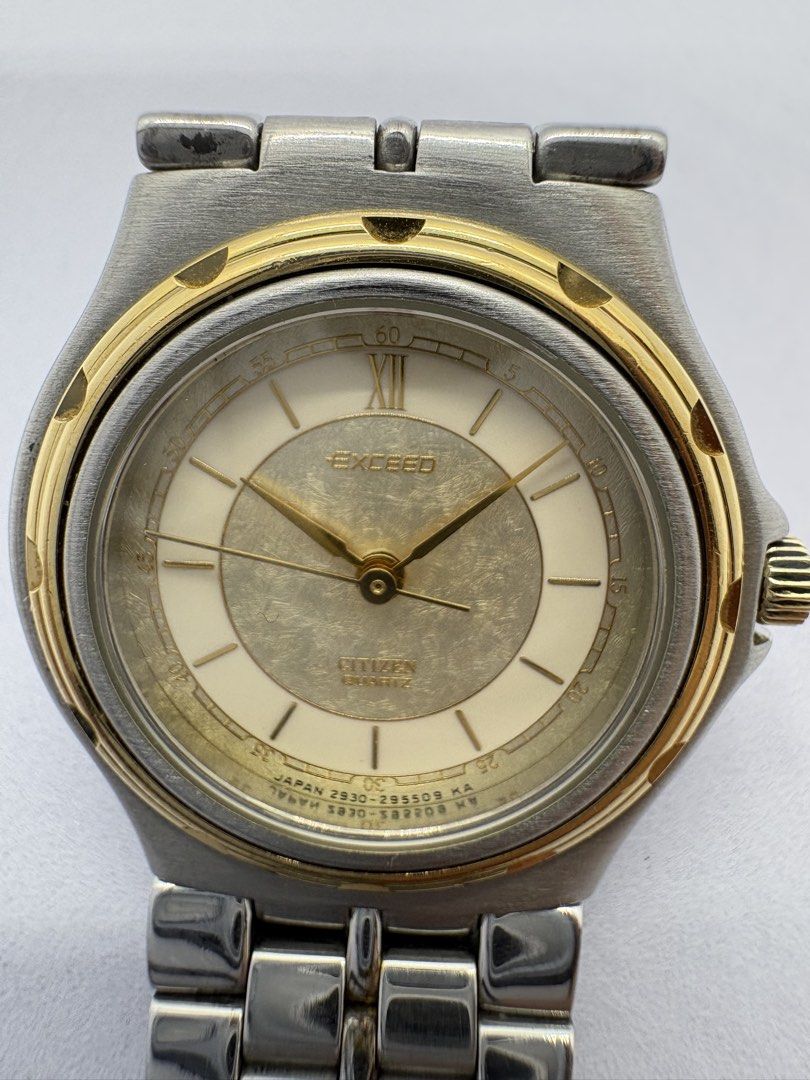 Citizen Exceed Quartz Watch (Category: Women's Watches) located in Quezon City. Submitted by rentoti (Listing ID 1464995855, Image 2). Description: - Brand/Model: Citizen Exceed Classic Dress Watch - Movement: Reliable Japan Quartz (Battery-powered) - Dial: Textured champagne dial with Roman numeral at 12 o'clock, stick markers, and gold hands - Design: Two-tone stainless steel and gold-plated bracelet with matching bezel details - Closure: Stand