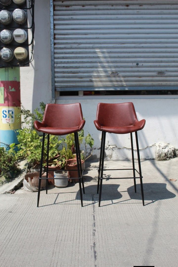 Ciunter/Bar Chair (Category: Chairs) located in Meycauayan. Submitted by marygracecasimiro (Listing ID 1465170152, Image 1). Description: Counter / Bar Chairs Set of 2 Risley S counter chairs with rich reddish-brown leather seats, black powder-coated steel frames and built-in footrests. Modern and versatile, perfect for kitchen counters, cafes, bars or office lounges L:18 ½ • W:17 • Seat H:28 • Back H:37 ¾ inches Set for only 9,900 pesos💚.