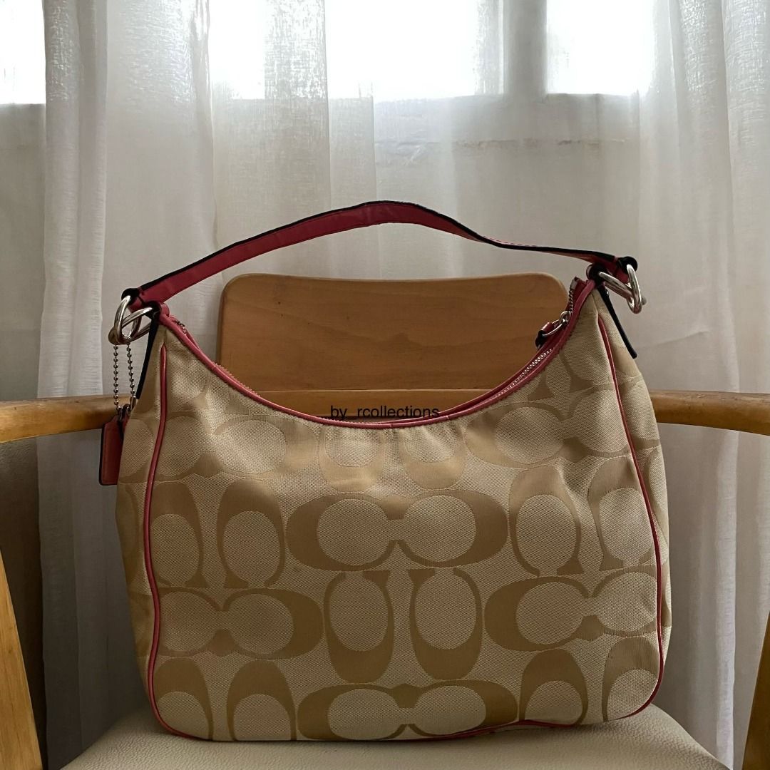 Coach Bag (Category: Shoulder Bags) located in Davao. Submitted by by_rcollections (Listing ID 1465002483, Image 2). Description: Khaki C-monogram canvas featuring a bold coral pink center stripe, matching pink leather trim, two hangtags, and silver-tone hardware. Issue crack patent, handle and stain. Shipping J&T .