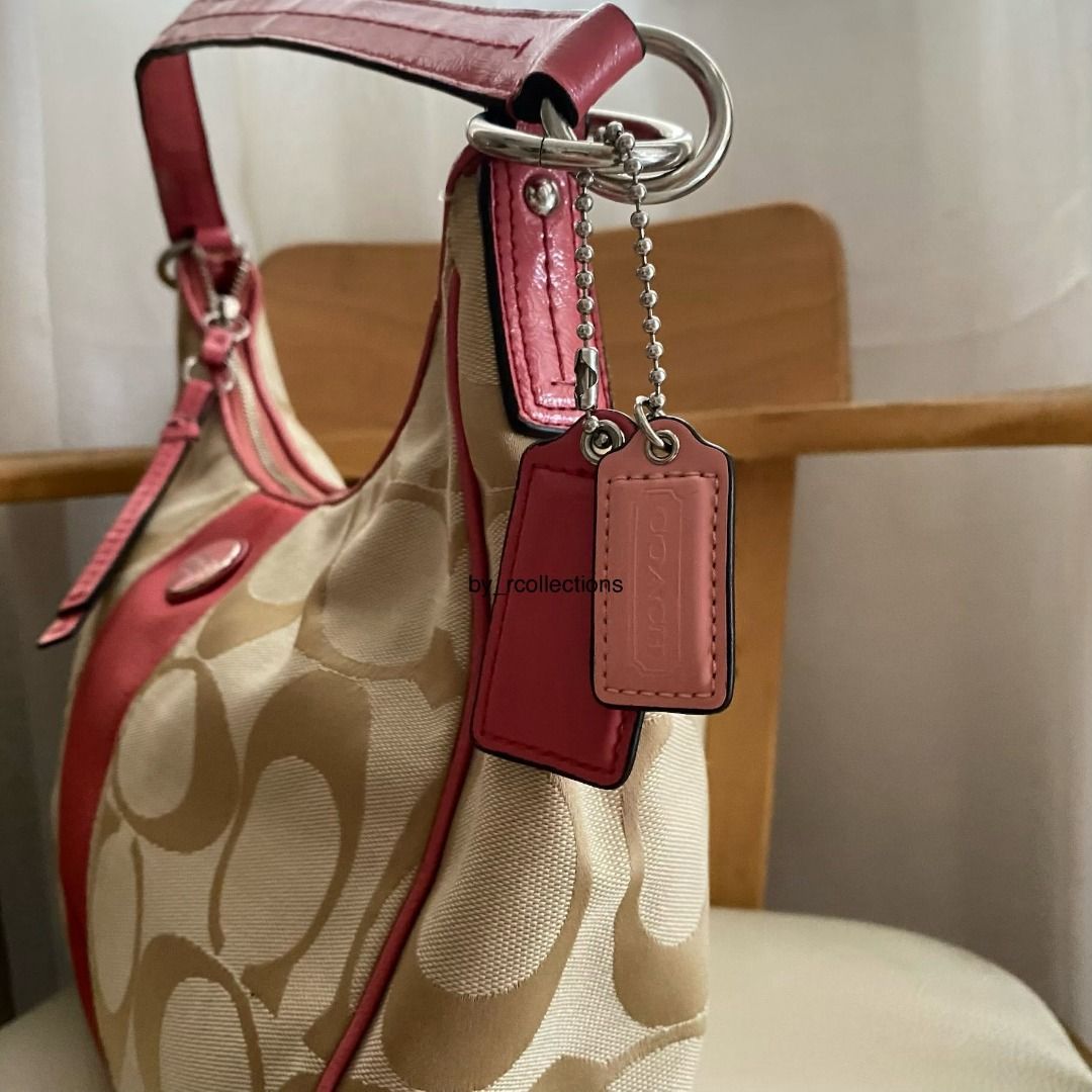 Coach Bag (Category: Shoulder Bags) located in Davao. Submitted by by_rcollections (Listing ID 1465002483, Image 3). Description: Khaki C-monogram canvas featuring a bold coral pink center stripe, matching pink leather trim, two hangtags, and silver-tone hardware. Issue crack patent, handle and stain. Shipping J&T .