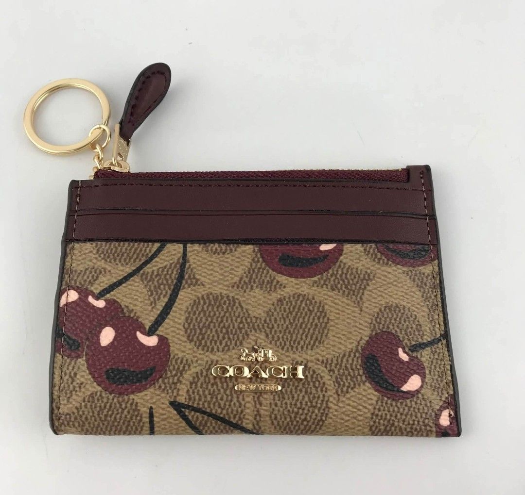 Coach Cardcase in Signature with Cherry Print (Category: Wallets & Card holders) located in Quezon City. Submitted by bagsboutiqueph (Listing ID 1465167785, Image 2). Description: LAST PRICE POSTED. LIMITED STOCKS! BRANDNEW WITH INCLUSIONS. COLOR MAY SLIGHTLY VARY IN ACTUAL DUE TO LIGHTING AND CAMERA SETTING. OTHER PHOTOS WILL BE SEND DURING PURCHASE AND FOR SURE BUYERS ONLY. WHEN IN DOUBT, DO NOT ORDER. THANK YOU..