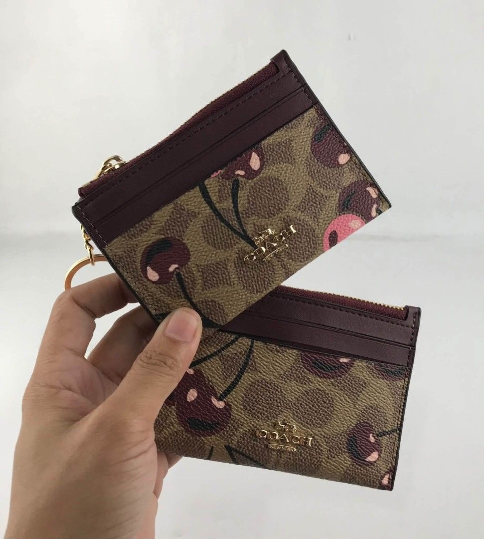 Coach Cardcase in Signature with Cherry Print (Category: Wallets & Card holders) located in Quezon City. Submitted by bagsboutiqueph (Listing ID 1465167785, Image 1). Description: LAST PRICE POSTED. LIMITED STOCKS! BRANDNEW WITH INCLUSIONS. COLOR MAY SLIGHTLY VARY IN ACTUAL DUE TO LIGHTING AND CAMERA SETTING. OTHER PHOTOS WILL BE SEND DURING PURCHASE AND FOR SURE BUYERS ONLY. WHEN IN DOUBT, DO NOT ORDER. THANK YOU..