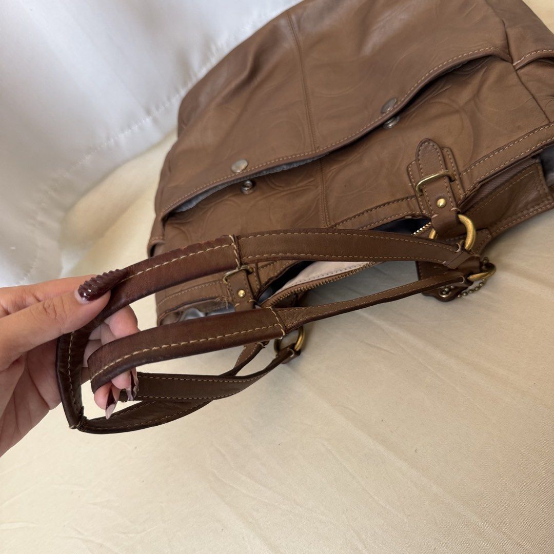 Coach Gallery Embossed Leather Tote Bag (Category: Tote Bags) located in Cebu City. Submitted by archivefinds (Listing ID 1464997469, Image 3). Description: Issue: - handle leather has a small chip/peeling spot - rubs on bottom sides - tarnish metal rings and plate - ink stain on interior .