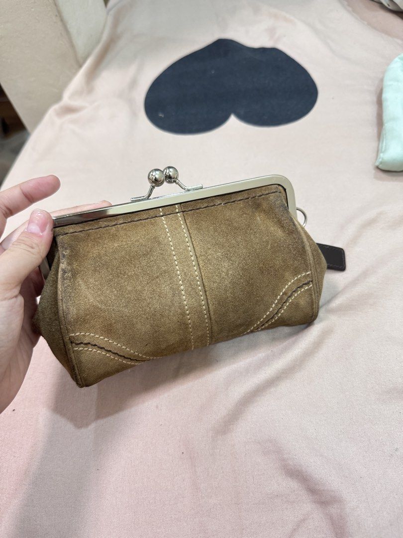 Coach Kisslock Suede Purse (Category: Purses & Pouches) located in Manila. Submitted by livelaughlovejay (Listing ID 1463685547, Image 3). Description: - Authentic Coach brown suede coin purse - Secure metal clasp closure - Stylish stitching details on the front - Includes original Coach leather tag - Ideal for organizing coins and small essentials.