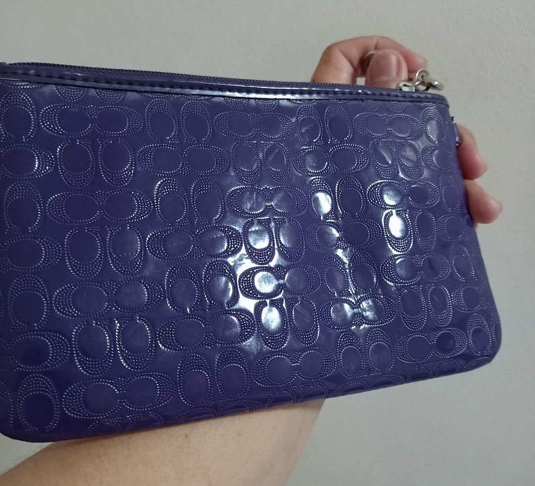 Coach Purple Wristlet (Category: Luxury Bags & Wallets) located in Siniloan. Submitted by treyyasonlineshop (Listing ID 1465077494, Image 2). Description: approx 8" missing leather strap.