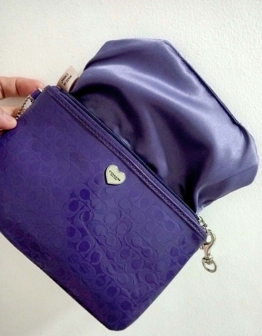 Coach Purple Wristlet (Category: Luxury Bags & Wallets) located in Siniloan. Submitted by treyyasonlineshop (Listing ID 1465077494, Image 1). Description: approx 8" missing leather strap.