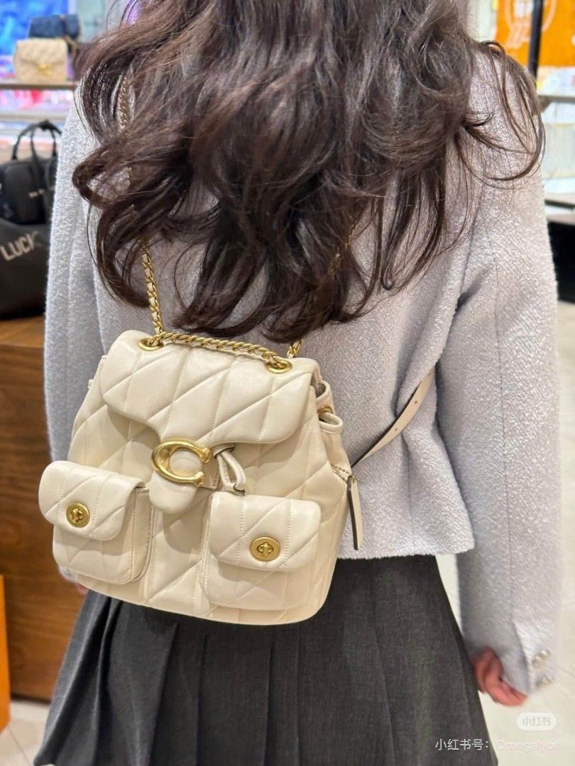 Coach Quilted Leather Backpack (Category: Backpacks) located in Manila. Submitted by onlineshopmate (Listing ID 1465136443, Image 1). Description: - Brand: Coach - Material: Quilted leather in a rich brown shade - Hardware: Antique brass tone - Closure: Signature C turnlock on main flap with drawstring underneath - Pockets: Twin front utility pockets - Straps: Chain top handle and adjustable leather shoulder straps - Condition: Brand new (protect