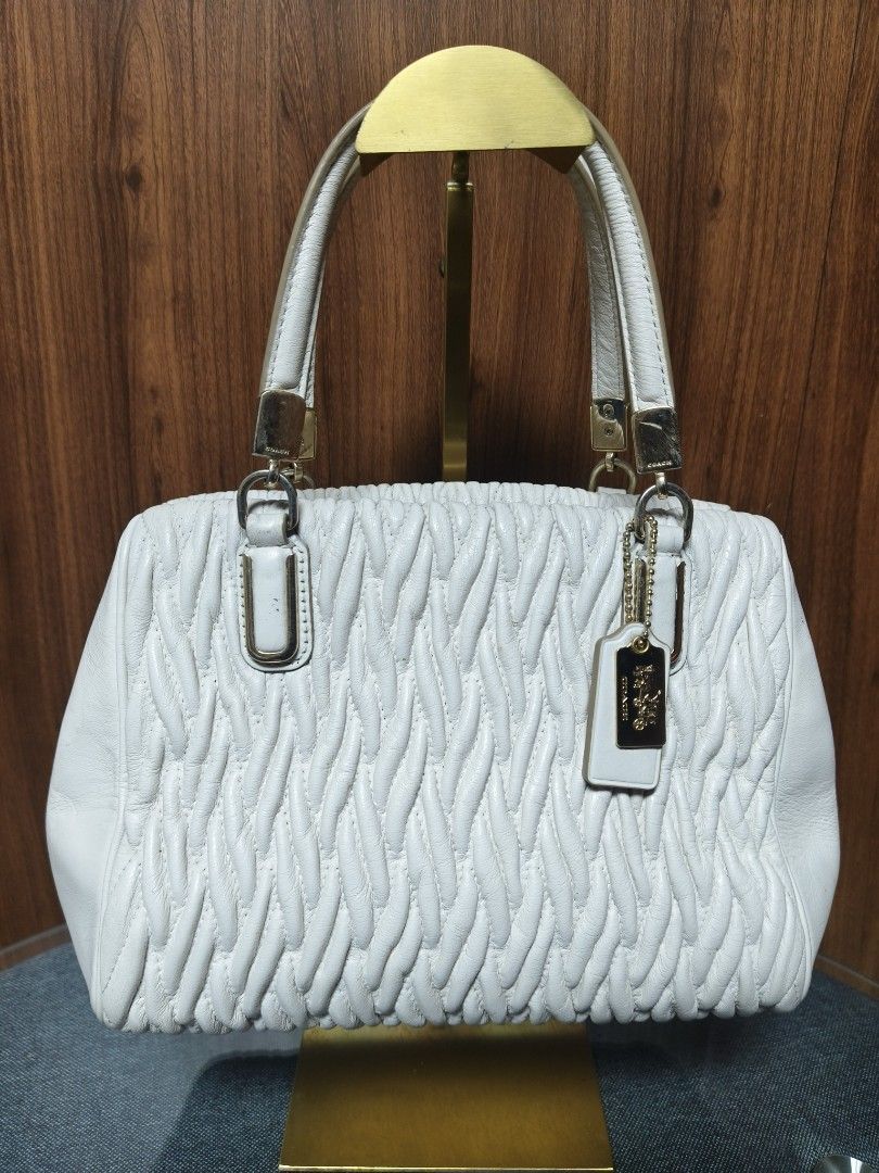 Coach Ruched Leather Satchel Bag (Category: Clutches) located in Baguio. Submitted by PreiLoveMaria (Listing ID 1465108505, Image 2). Description: Coach Ruched Leather Satchel Bag 🤍 Classic, chic, and sophisticated! This gorgeous Coach satchel features a stylish chevron-quilted/ruched leather design with gold-tone hardware and signature charms. A timeless piece that elevates any outfit. Good used condition with normal signs of wear. Please check