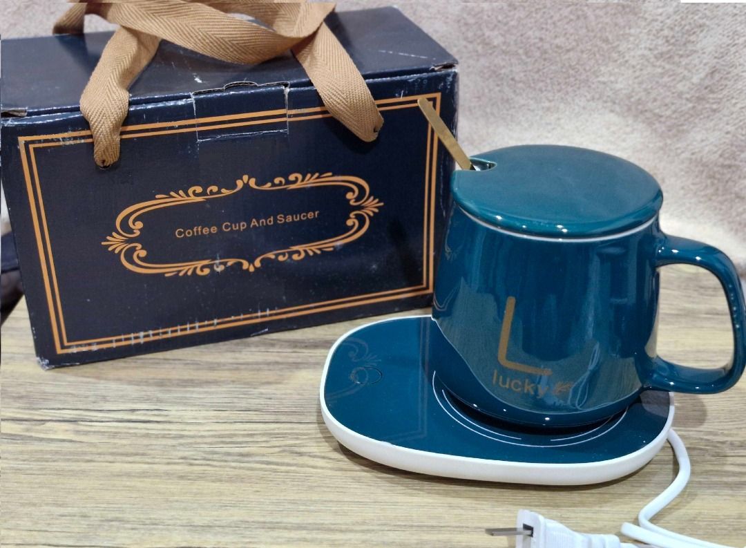 Coffee Mug With Electric Warmer Coaster And Spoon (Category: Coffee & Tea Tableware) located in Davao. Submitted by j_guitarist (Listing ID 1465072418, Image 1). Description: - Color: Dark green ceramic mug with elegant gold spoon - Size: 400ml - Power: 16 watts - Features built-in electric heating coaster to keep drinks warm at your desk - Includes a matching lid to trap heat and dust - Beautifully packaged in an original dark green presentation