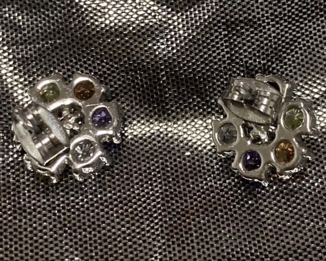 Colorful crystal flower cluster stud earrings silver tone (Category: Earrings) located in Manila. Submitted by bwshoppe (Listing ID 1465049175, Image 3). Description: - Design: Adorable flower-shaped cluster studs in silver-tone metal - Details: Multi-colored round crystals surrounding a central flower motif - Closure: Standard butterfly push backs for secure wear - Versatility: Sparkly statement piece suitable for daily wear or special occasions