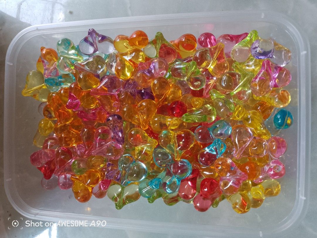 Colorful heart-shaped translucent acrylic beads bulk set (Category: Craft Supplies & Tools) located in San Jose del Monte. Submitted by dollies18 (Listing ID 1465021170, Image 3). Description: - Assorted heart beads in vibrant transparent colors (pink, orange, yellow, blue, purple, green) - Smooth and glossy finish - Ideal for jewelry making, friendship bracelets, keychains, and DIY crafts - Includes a convenient clear plastic storage container -