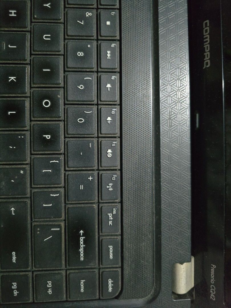 Compaq Presario CQ42 Laptop (Category: Laptops & Notebooks) located in Antipolo. Submitted by purpleshop.ph (Listing ID 1465064253, Image 3). Description: - Model: Compaq Presario CQ42 - Processor: Intel Core - Design: Textured black lid with matching patterned palm rest - Audio: Built-in Altec Lansing speakers - Keyboard: Standard QWERTY layout with top-row numeric keys - Condition: Powers up fine, works great for basic typing and web browsing N