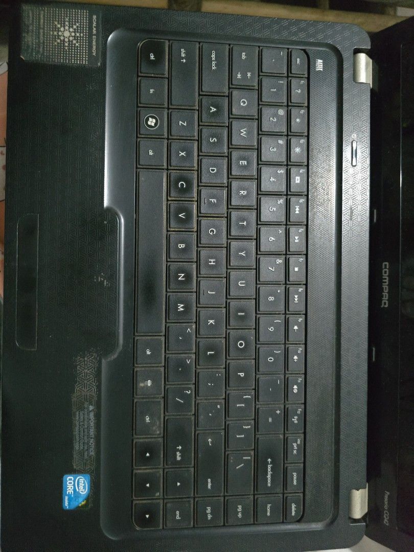Compaq Presario CQ42 Laptop (Category: Laptops & Notebooks) located in Antipolo. Submitted by purpleshop.ph (Listing ID 1465064253, Image 2). Description: - Model: Compaq Presario CQ42 - Processor: Intel Core - Design: Textured black lid with matching patterned palm rest - Audio: Built-in Altec Lansing speakers - Keyboard: Standard QWERTY layout with top-row numeric keys - Condition: Powers up fine, works great for basic typing and web browsing N