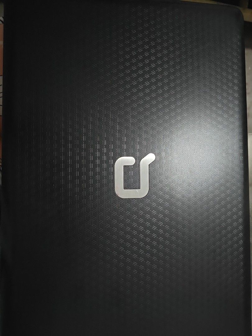 Compaq Presario CQ42 Laptop (Category: Laptops & Notebooks) located in Antipolo. Submitted by purpleshop.ph (Listing ID 1465064253, Image 1). Description: - Model: Compaq Presario CQ42 - Processor: Intel Core - Design: Textured black lid with matching patterned palm rest - Audio: Built-in Altec Lansing speakers - Keyboard: Standard QWERTY layout with top-row numeric keys - Condition: Powers up fine, works great for basic typing and web browsing N